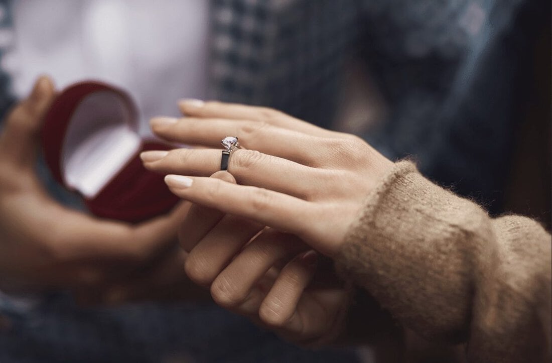 Woman trying on Denver engagement rings