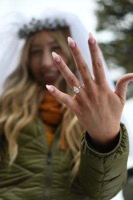 model posing with engagement from denver jewelers, jewelry store denver