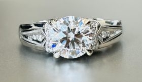 white gold vintage engagement ring with a round diamond