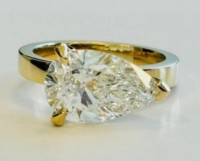 East West pear shape diamond ring