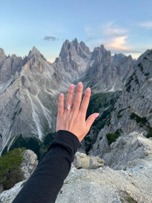 Hunter’s marquise diamond engagement ring from Mark’s Diamonds shines against the dramatic peaks of the Dolomites at Cadini di Misurina.