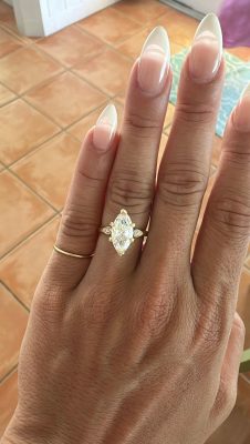 Katy’s stunning marquise diamond engagement ring from Mark’s Diamonds shines under the Bahamas sun after Ted’s romantic beach proposal.