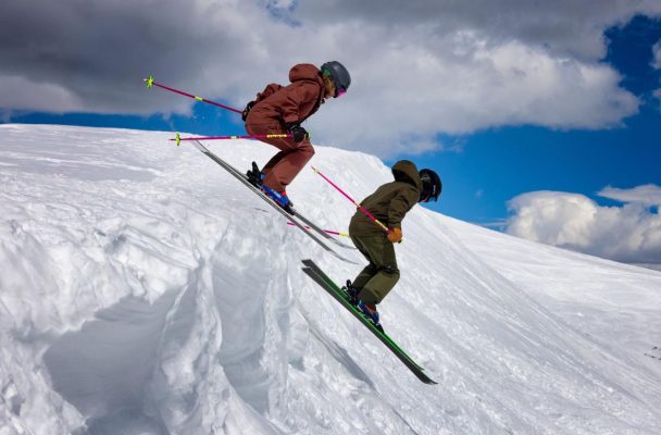 Nate and Samantha skiing down Breckenridge slopes after their epic mountain top proposal – celebrating love and adventure together.